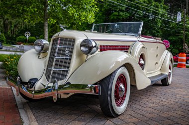 Highlands, NC - June 10, 2022: Low perspective front corner view of a 1936 Auburn 852 2 Door Cabriolet at a local car show.