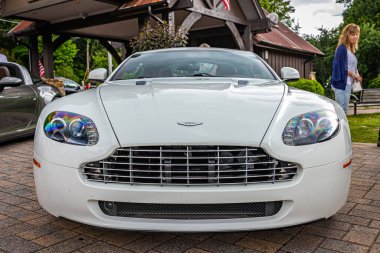Highlands, NC - June 10, 2022: Low perspective front view of a 2011 Aston Martin V8 Vantage N420 Hardtop Coupe at a local car show.