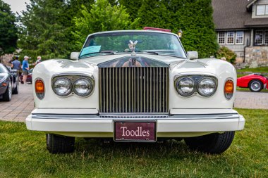 Highlands, NC - June 10, 2022: Low perspective front view of a 1989 Rolls-Royce Corniche II Convertible at a local car show.