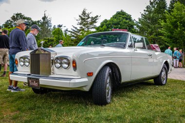 Highlands, NC - June 10, 2022: Low perspective front corner view of a 1989 Rolls-Royce Corniche II Convertible at a local car show.