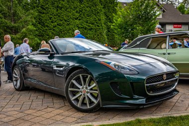 Highlands, NC - June 10, 2022: Low perspective front corner view of a 2014 Jaguar F-Type V8 S Convertible at a local car show.