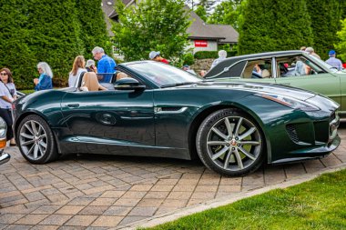 Highlands, NC - June 10, 2022: Low perspective side view of a 2014 Jaguar F-Type V8 S Convertible at a local car show.