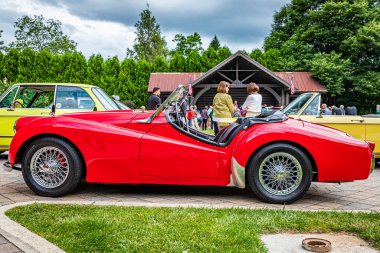Highlands, NC - June 10, 2022:  Low perspective side view of a 1957 Triumph TR3 Cabriolet at a local car show.