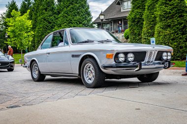 Highlands, NC - June 10, 2022: Low perspective front corner view of a 1971 BMW 3.0 CS Coupe leaving  a local car show.