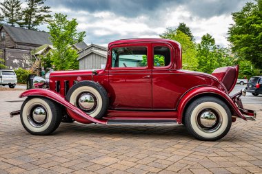 Highlands, NC - June 10, 2022:  Low perspective side view of a 1932 Chevrolet Rumble Seat Coupe at a local car show.