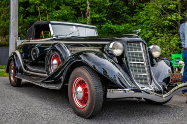 Highlands, NC - June 11, 2022: Low perspective front corner view of a 1936 Auburn 852 Cabriolet at a local car show.