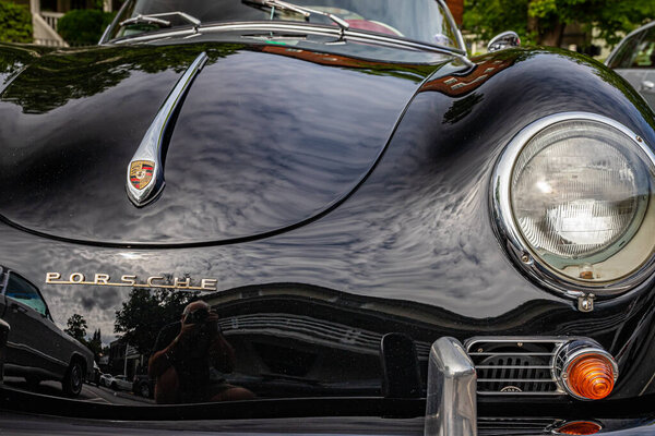 Highlands, NC - June 11, 2022: Close up detail view of a 1958 Porsche 356A Speedster Convertible hood and headlight at a local car show.