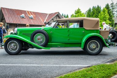 Highlands, NC - June 11, 2022: Low perspective side view of a 1929 Duesenberg  J-Murphy Convertible Berline at a local car show.