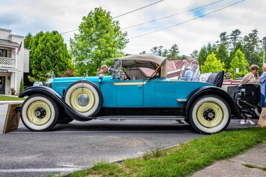 Highlands, NC - June 11, 2022: Low perspective side view of a 1928 Packard Super 8 Roadster at a local car show.