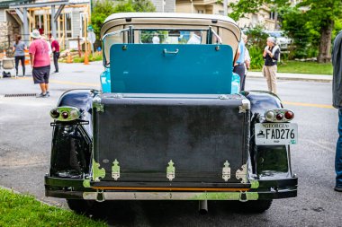 Highlands, NC - June 11, 2022: Low perspective rear view of a 1928 Packard Super 8 Roadster at a local car show.
