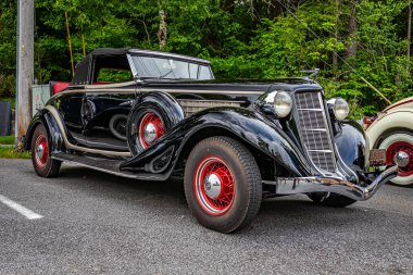 Highlands, NC - June 11, 2022: Low perspective front corner view of a 1936 Auburn 852 Cabriolet at a local car show.
