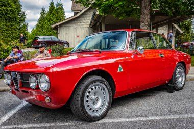 Highlands, NC - June 10, 2022: Low perspective front corner view of a 1971 Alfa Romeo 1750 GTV Hardtop Coupe at a local car show.