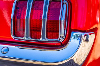 Statesboro, GA - May 17, 2014: Shallow depth of field closeup of the taillight aseembly details on a 1965 Ford Mustang 2+2 Fastback.