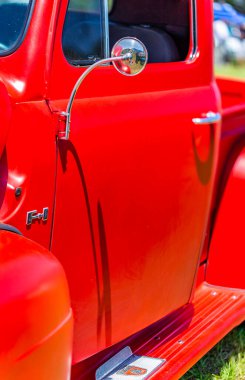 Statesboro, GA - May 17, 2014: Shallow depth of field closeup of the door details on a 1949 Ford Bonus Built F1 half ton pickup truck.