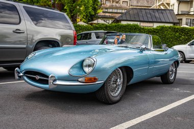Highlands, NC - June 11, 2022: Low perspective front corner view of a 1965 Jaguar E Type Series 1 4.2 Roadster at a local car show.