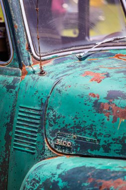 Statesboro, GA - May 17, 2014: Shallow depth of field closeup of the front cowl details of a 1950 Chevrolet Advance Design 3100 pickup truck.