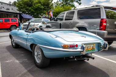Highlands, NC - June 11, 2022: Low perspective rear corner view of a 1965 Jaguar E Type Series 1 4.2 Roadster at a local car show.