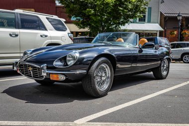 Highlands, NC - June 11, 2022: Low perspective front corner view of a 1975 Jaguar E-Type V12 Roadster at a local car show.