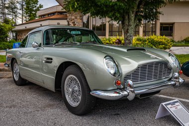 Highlands, NC - June 11, 2022: Low perspective front corner view of a 1965 Aston Martin DB5 Hardtop Coupe at a local car show.