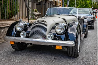 Highlands, NC - June 11, 2022: Low perspective front view of a 1986 Morgan Plus 8 Convertible at a local car show.