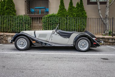 Highlands, NC - June 11, 2022: Low perspective side view of a 1986 Morgan Plus 8 Convertible at a local car show.