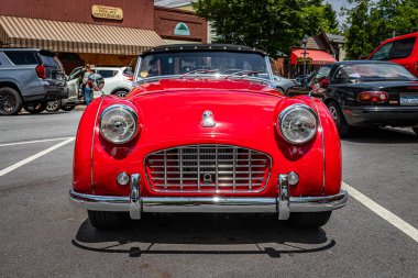 Highlands, NC - June 10, 2022: Low perspective front view of a 1957 Triumph TR3 Cabriolet at a local car show.