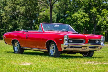 Statesboro, GA - May 17, 2014: Shallow depth of field front corner view of a 1966 Pontiac Tempest Custom Sprint 6 Convertible.