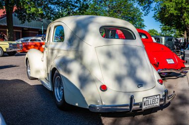 Falcon Heights, MN - June 17, 2022: Low perspective rear corner view of a 1938 Willys Overland 2 Door Sedan at a local car show.