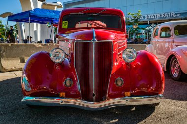 Falcon Heights, MN - June 17, 2022:  Low perspective front view of a 1936 Ford 5 Window Coupe at a local car show.
