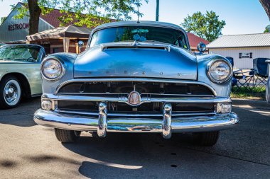 Falcon Heights, MN - June 17, 2022: Low perspective front view of a 1954 Hudson Hornet Hardtop Coupe at a local car show.
