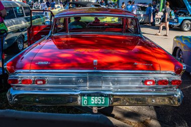 Falcon Heights, MN - June 17, 2022: High perspective rear view of a 1964 Mercury Montclair Breezeway Sedan at a local car show.