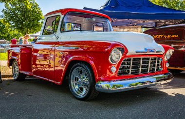 Falcon Heights, MN - June 17, 2022: Low perspective front corner view of a 1956 Chevrolet Task Force 3600 Pickup Truck at a local car show.