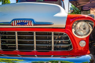 Falcon Heights, MN - June 17, 2022: Close up detail view of a 1956 Chevrolet Task Force 3600 Pickup Truck grille and headlights at a local car show.