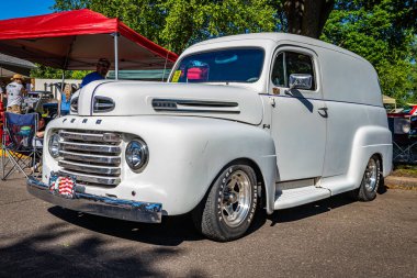 Falcon Heights, MN - June 17, 2022: Low perspective front corner view of a 1948 Ford F1 Panel Delivery Truck at a local car show.