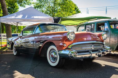 Falcon Heights, MN - June 17, 2022: Low perspective front corner view of a 1957 Buick Century 2 Door Hardtop Coupe at a local car show.