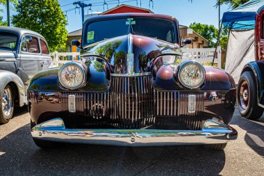 Falcon Heights, MN - June 17, 2022: Low perspective front view of a 1940 Oldsmobile Series 70 2 Door Sedan at a local car show.