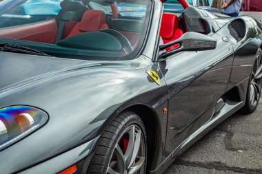 Tybee Island, GA - October 14, 2017: Side view of a 2006 Ferrari F430 Spider Roadster at a local car show.