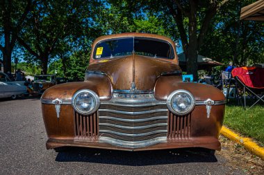 Falcon Heights, MN - June 17, 2022: Low perspective front view of a 1941 Oldsmobile Series 60 Club Coupe at a local car show.