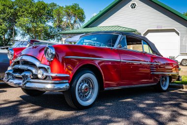 Falcon Heights, MN - June 17, 2022: Low perspective front corner view of a 1954 Packard Pacific Convertible Coupe at a local car show.