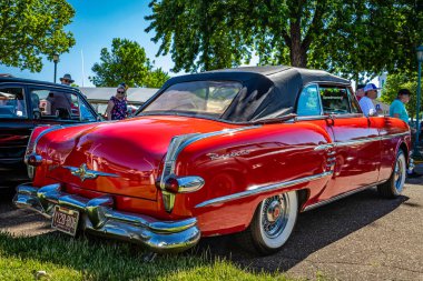 Falcon Heights, MN - June 17, 2022: High perspective rear corner view of a 1954 Packard Pacific Convertible Coupe at a local car show.