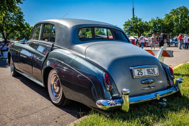 Falcon Heights, MN - June 17, 2022: High perspective rear corner view of a 1960 Rolls Royce Silver Cloud II Sedan at a local car show.