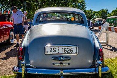 Falcon Heights, MN - June 17, 2022: High perspective rear view of a 1960 Rolls Royce Silver Cloud II Sedan at a local car show.