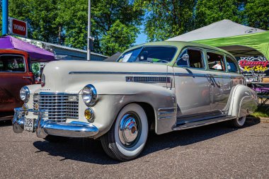 Falcon Heights, MN - June 17, 2022: Low perspective front corner view of a 1941 Cadillac Series 75 Touring Imperial Limousine at a local car show.