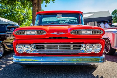 Falcon Heights, MN - June 17, 2022: Low perspective front view of a 1960 Chevrolet Apache 10 Fleetside Pickup Truck at a local car show.