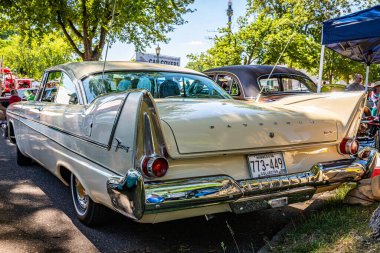 Falcon Heights, MN - June 17, 2022: Low perspective rear corner view of a 1958 Plymouth Fury Golden Commando Coupe at a local car show.