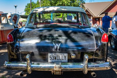 Falcon Heights, MN - June 17, 2022: Low perspective rear view of a 1953 Willys Aero Ace Hardtop Coupe at a local car show.