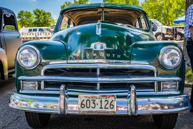 Falcon Heights, MN - June 17, 2022: Low perspective front view of a 1950 Plymouth Special Deluxe Coupe at a local car show.