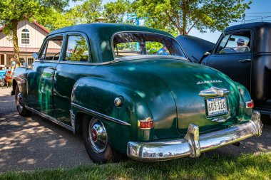 Falcon Heights, MN - June 17, 2022: Low perspective rear corner view of a 1950 Plymouth Special Deluxe Coupe at a local car show.