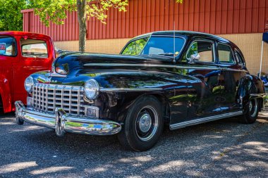 Falcon Heights, MN - June 17, 2022: Low perspective front corner view of a 1946 Dodge D24 Custom 4 Door Sedan at a local car show.