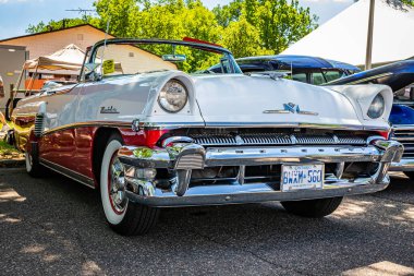 Falcon Heights, MN - June 17, 2022: Low perspective front corner view of a 1956 Mercury Montclair Convertible at a local car show.
